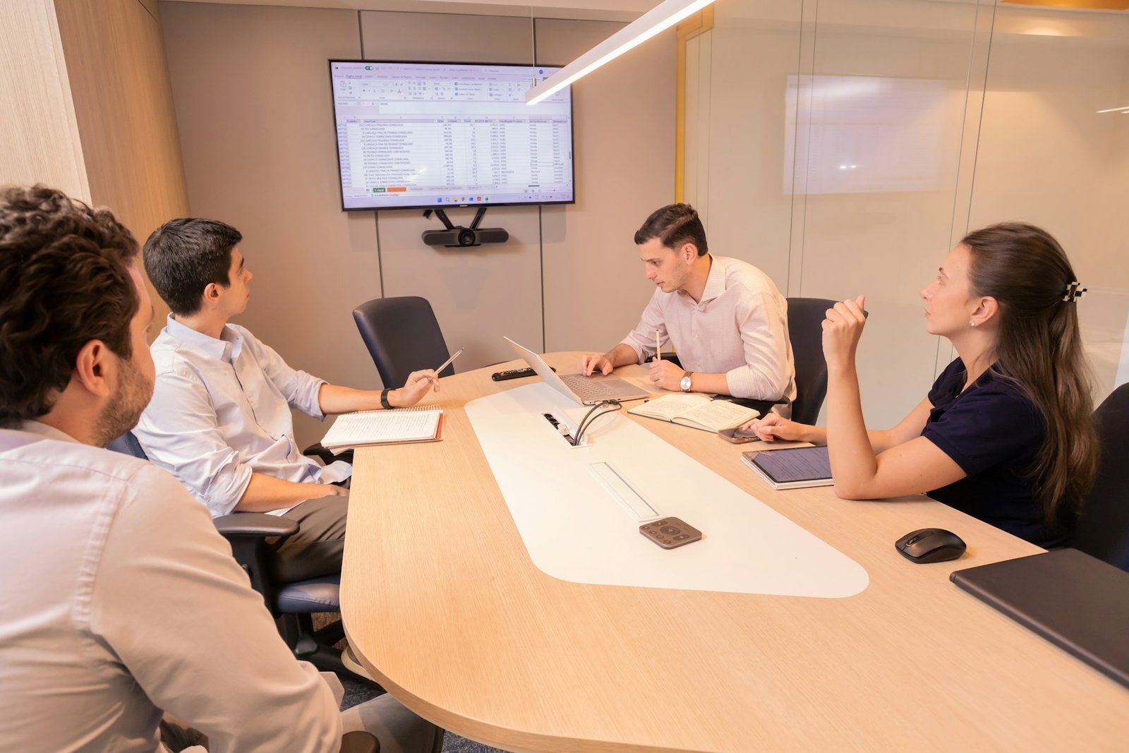 Industry experts in a focused strategy conversation around a conference table